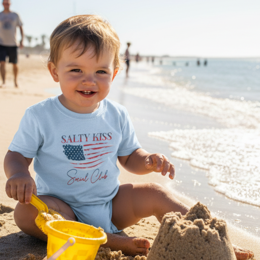 Toddler wearing USA t-shirt at beach